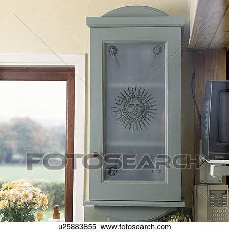 Close-up of engraved glass panel in grey-green nkitchen cupboard door View Large Photo Image Stock Photography - Close-up of engraved glass panel in grey-green nkitchen cupboard door . Fotosearch