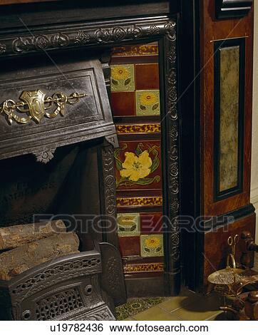Stock Photograph - Close-up of fireplace with Victorian tiles. Fotosearch