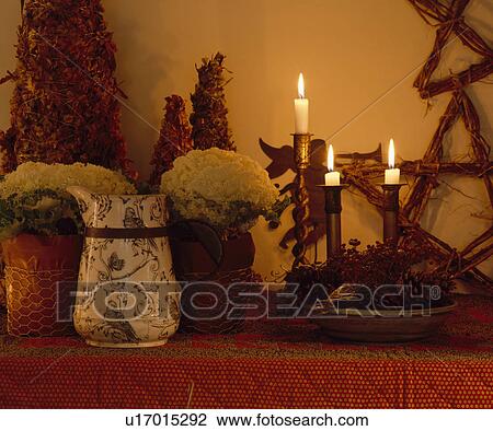 Close-up of floral jug and lighted candle View Large Photo Image Stock Image - Close-up of floral jug and lighted candle . Fotosearch