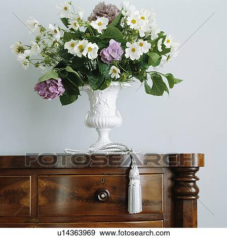 Stock Photo - Close-up of fresh flower arrangement on chest. Fotosearch