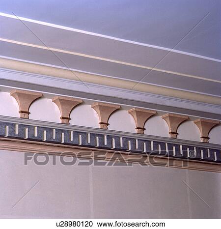 Stock Image - Close-up of gilt plasterwork cornice. Fotosearch