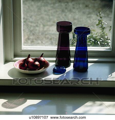 Close Up Of Glass Bulb Vases On Windowsill Stock Photo U10897107