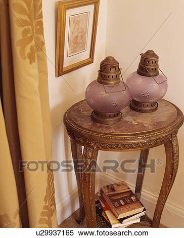Close-up of glass lanterns on antique table View Large Photo Image Stock Photography - Close-up of glass lanterns on antique table. Fotosearch