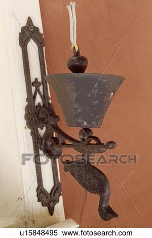 Close up of iron bird motif bell on front door View Large Photo Image Stock Photography - Close up of iron bird motif bell on front door. Fotosearch