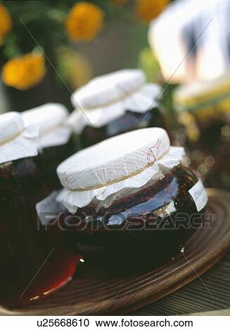 Close-up of jars of jam with white paper covers View Large Photo Image Stock Image - Close-up of jars of jam with white paper covers. Fotosearch
