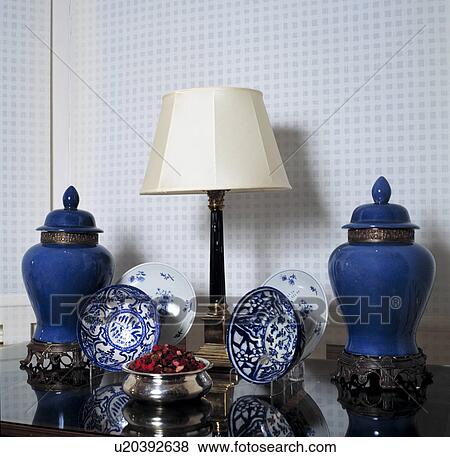 Close-up of lamp and collection of blue+white china View Large Photo Image Stock Photo - Close-up of lamp and collection of blue+white china. Fotosearch