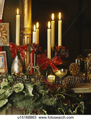 Close-up of lighted candles with Christmas ivy and conifer View Large Photo Image Stock Image - Close-up of lighted candles with Christmas ivy and conifer. Fotosearch