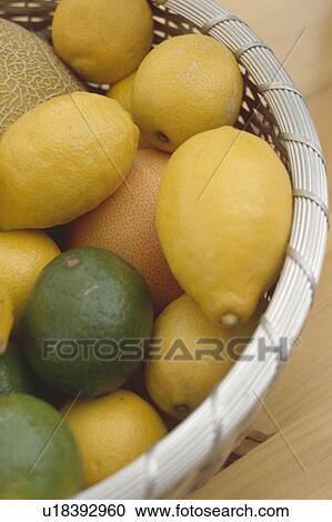 Close-up of metal basket of fresh lemons and limes View Large Photo Image Stock Image - Close-up of metal basket of fresh lemons and limes. Fotosearch