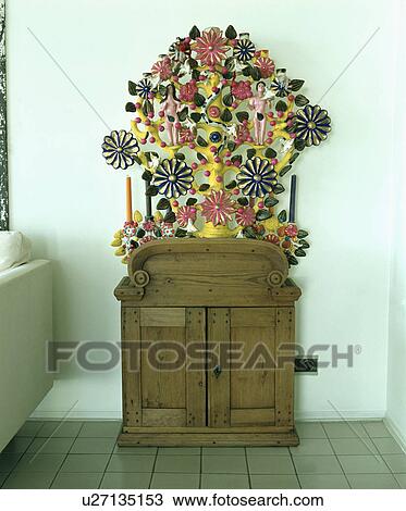 Close-up of Mexican ceramic wall hanging above pine cupboard View Large Photo Image Stock Image - Close-up of Mexican ceramic wall hanging above pine cupboard. Fotosearch