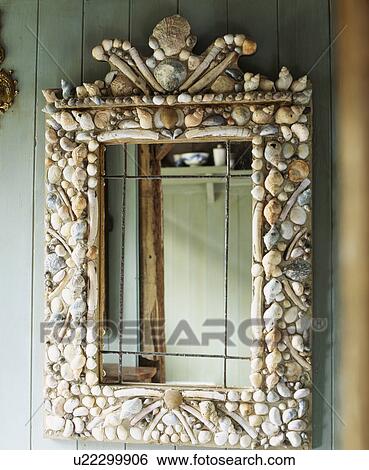 Close-up of mirror with seashell frame View Large Photo Image Stock Photograph - Close-up of mirror with seashell frame. Fotosearch