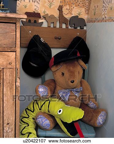 Stock Photo - Close-up of Noah's Ark pegboard with boys' caps and teddybear with felt snake. Fotosearch