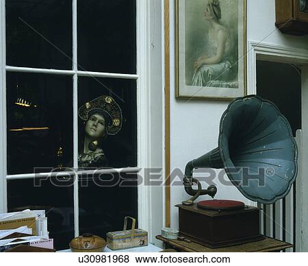 Stock Photo - Close-up of old phonograph in front of window. Fotosearch