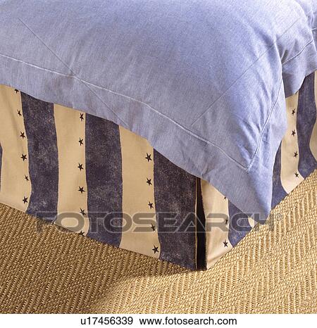 Close-up of pale blue duvet and blue+white striped vallance on bed on sisal carpet View Large Photo Image Stock Photo - Close-up of pale blue duvet and blue+white striped vallance on bed on sisal carpet. Fotosearch