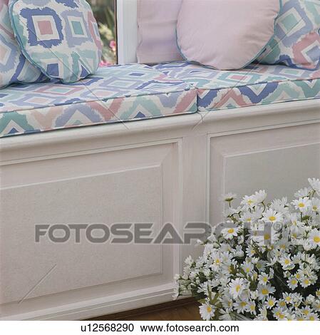 Close up of pink and turquoise patterned cushions on windowseat View Large Photo Image Stock Image - Close up of pink and turquoise patterned cushions on windowseat. Fotosearch