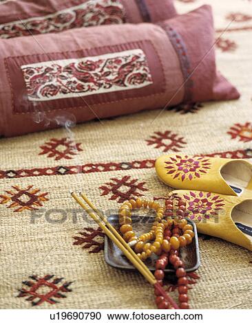 Close-up of pink cushions and jewellery on patterned sisal rug View Large Photo Image Stock Image - Close-up of pink cushions and jewellery on patterned sisal rug. Fotosearch
