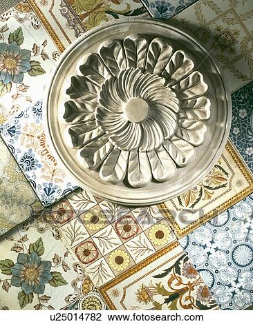 Close-up of plaster ceiling rose on reclaimed Victorian tiles View Large Photo Image Stock Image - Close-up of plaster ceiling rose on reclaimed Victorian tiles. Fotosearch