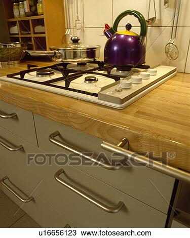 Close-up of purple Alessi kettle on white gas hob View Large Photo Image Stock Image - Close-up of purple Alessi kettle on white gas hob. Fotosearch
