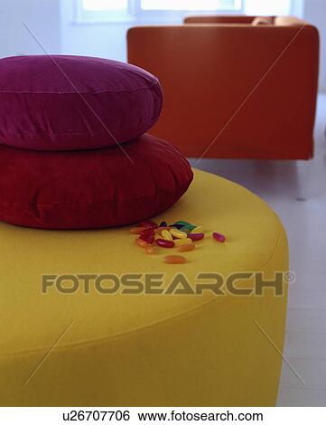 Close-up of purple cushions on modern yellow upholstered stool View Large Photo Image Stock Photograph - Close-up of purple cushions on modern yellow upholstered stool. Fotosearch