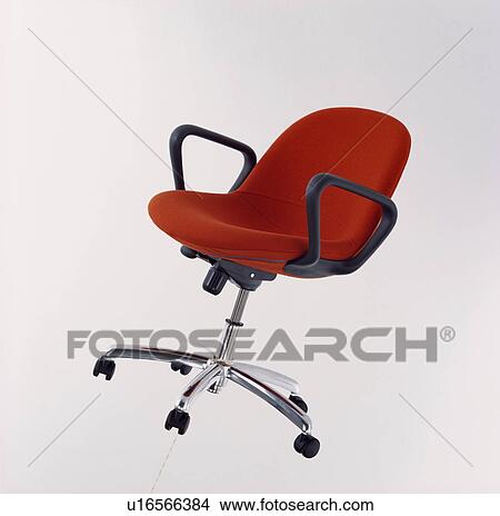 Picture - Close-up of red swivel office chair . Fotosearch