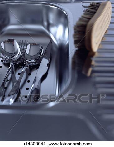 Close-up of scrubbing brush and stainless steel cutlery in stainless steel sink View Large Photo Image Stock Image - Close-up of scrubbing brush and stainless steel cutlery in stainless steel sink. Fotosearch