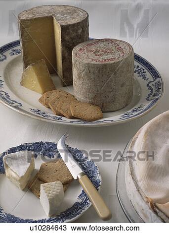 Stock Image - Close up of selection of cheeses. Fotosearch