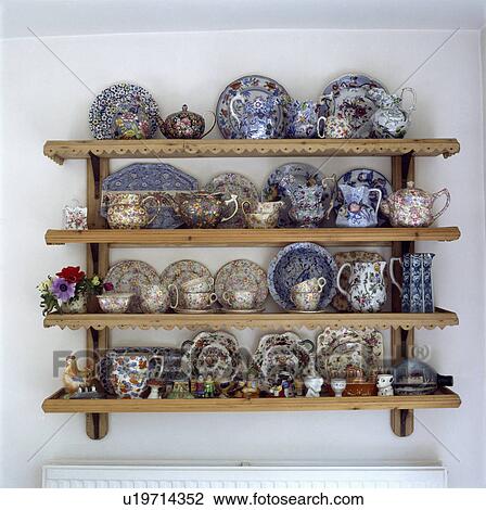 Close-up of shelves with collection of Chintz and blue+white antique china View Large Photo Image Stock Image - Close-up of shelves with collection of Chintz and blue+white antique china. Fotosearch