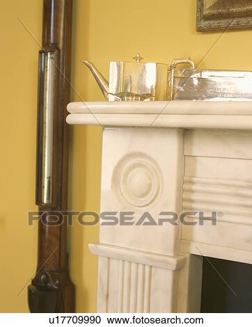 Close-up of silver teapot on marble fireplace View Large Photo Image Stock Image - Close-up of silver teapot on marble fireplace. Fotosearch