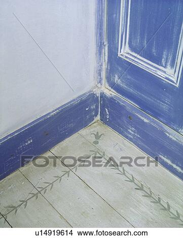 Close-up of stencilled floorboard and blue distressed paint effect door and skirtingboard View Large Photo Image Picture - Close-up of stencilled floorboard and blue distressed paint effect door and skirtingboard. Fotosearch