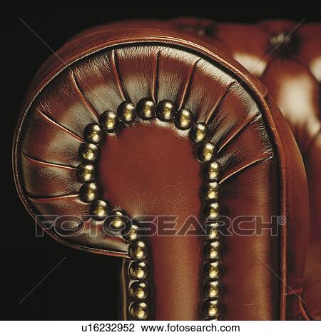 Close-up of studded brown leather sofa View Large Photo Image Stock Image - Close-up of studded brown leather sofa. Fotosearch