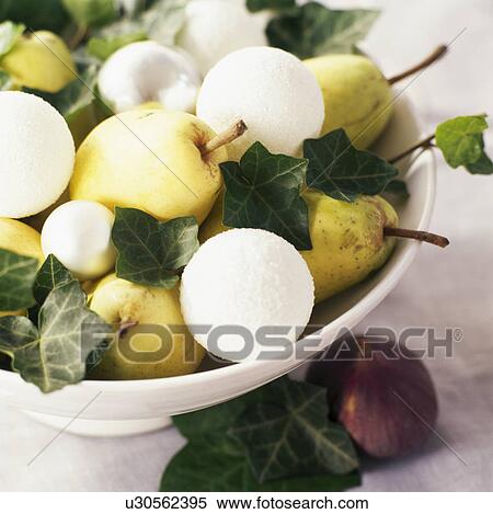 Close-up of white bowl with pears and white Christmas baubles decorated with ivy leaves View Large Photo Image Stock Photography - Close-up of white bowl with pears and white Christmas baubles decorated with ivy leaves. Fotosearch