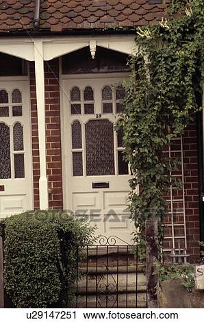 Stock Image - Close-up of white Edwardian front door. Fotosearch