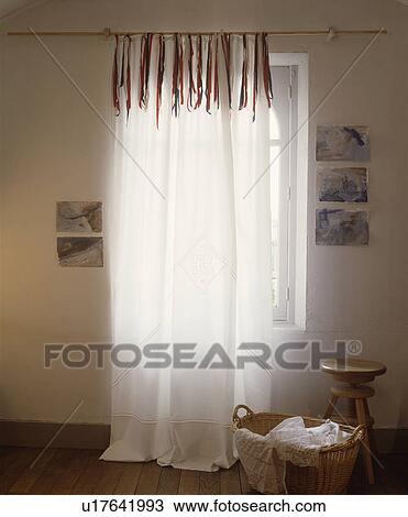 Close-up of white voile curtain with ribbon decoration View Large Photo Image Stock Image - Close-up of white voile curtain with ribbon decoration. Fotosearch