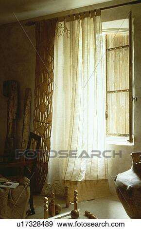 Close-up of window with cream linen curtain View Large Photo Image Stock Photo - Close-up of window with cream linen curtain. Fotosearch