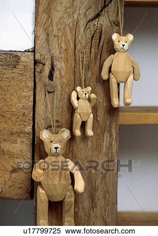 Close-up of wooden bears on beam View Large Photo Image Stock Photography - Close-up of wooden bears on beam. Fotosearch