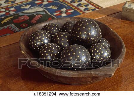 Close-up of wooden bowl with studded wooden balls View Large Photo Image Picture - Close-up of wooden bowl with studded wooden balls . Fotosearch