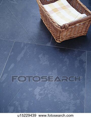 Close-up of wooden storage basket on slate floor tiles View Large Photo Image Stock Photo - Close-up of wooden storage basket on slate floor tiles. Fotosearch