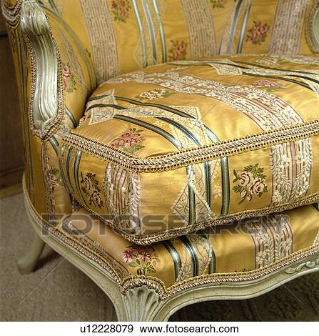 Close-up of yellow floral silk upholstered antique chair View Large Photo Image Stock Photo - Close-up of yellow floral silk upholstered antique chair. Fotosearch