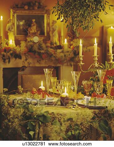 Closeup of Christmas decorated diningroom with mistletoe hanging over table and candles. View Large Photo Image Stock Image - Closeup of Christmas decorated diningroom with mistletoe hanging over table and candles. . Fotosearch
