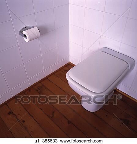 Closeup of WC or toilet in white tiled room View Large Photo Image Stock Image - Closeup of WC or toilet in white tiled room. Fotosearch