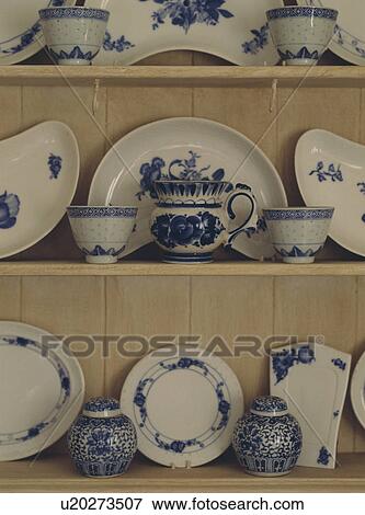 Collection of blue and white china on cream dresser shelves View Large Photo Image Stock Photo - Collection of blue and white china on cream dresser shelves. Fotosearch