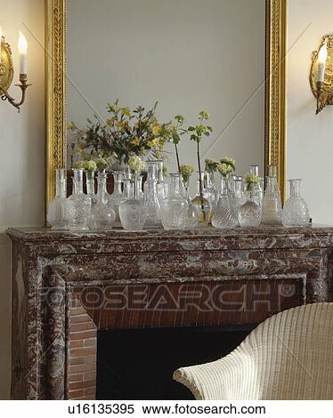 Collection of glass decanters on mantelpiece View Large Photo Image Stock Photography - Collection of glass decanters on mantelpiece. Fotosearch