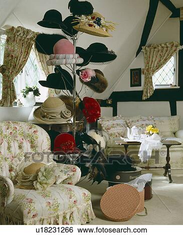 Collection of hats on stand in small attic livingroom View Large Photo Image Stock Photograph - Collection of hats on stand in small attic livingroom. Fotosearch