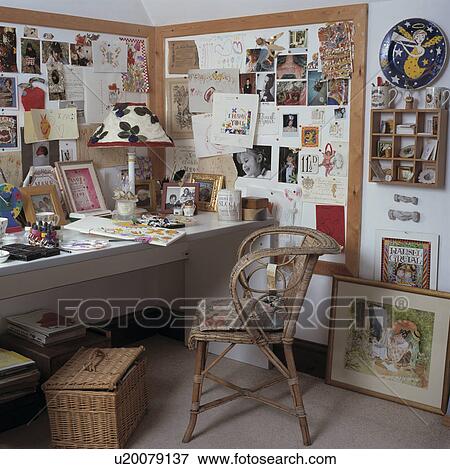 Stock Photo - Corner of livingroom has been turned into a home office.. Fotosearch