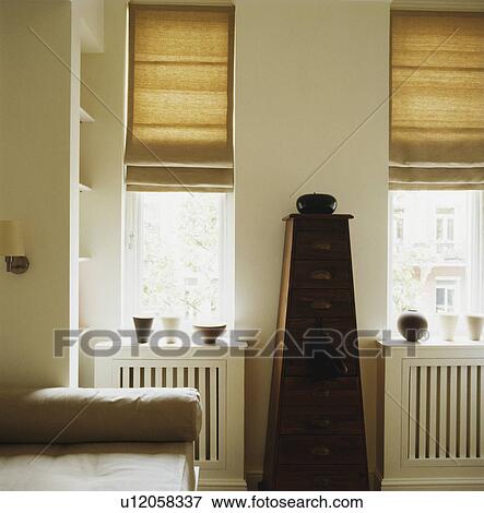 Stock Photo - Cream blinds in traditional living room. Fotosearch