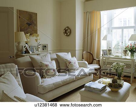 Cream sofa in traditional living room View Large Photo Image Stock Photo - Cream sofa in traditional living room . Fotosearch