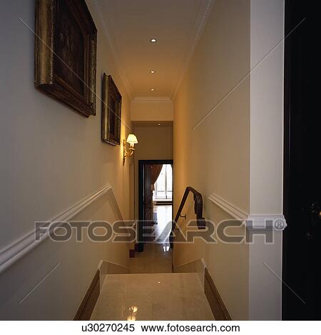 Dado-rails on walls of narrow white staircase View Large Photo Image Stock Photography - Dado-rails on walls of narrow white staircase . Fotosearch