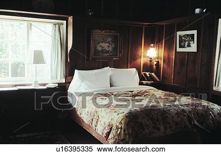 Stock Photography - Dark Bedroom with Bedside Lamp.. Fotosearch