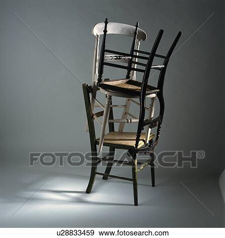 Detail, a pile of three chairs View Large Photo Image Stock Photo - Detail, a pile of three chairs . Fotosearch