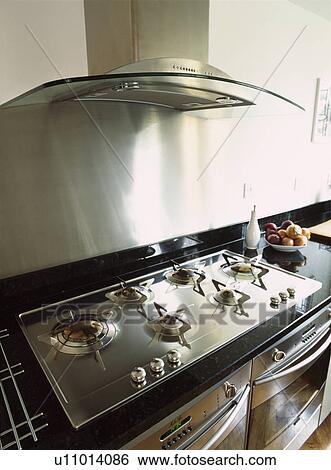 Detail of contemporary stainless steel cooker hood and hob View Large Photo Image Stock Photograph - Detail of contemporary stainless steel cooker hood and hob . Fotosearch