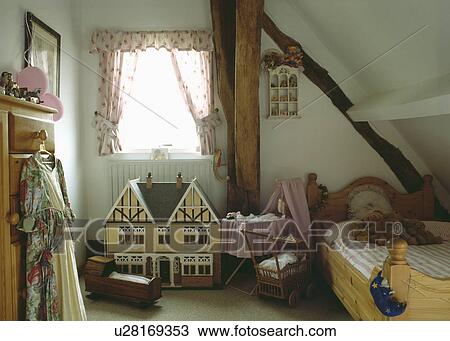 Dolls house and vintage toys in child's attic bedroom View Large Photo Image Stock Image - Dolls house and vintage toys in child's attic bedroom. Fotosearch